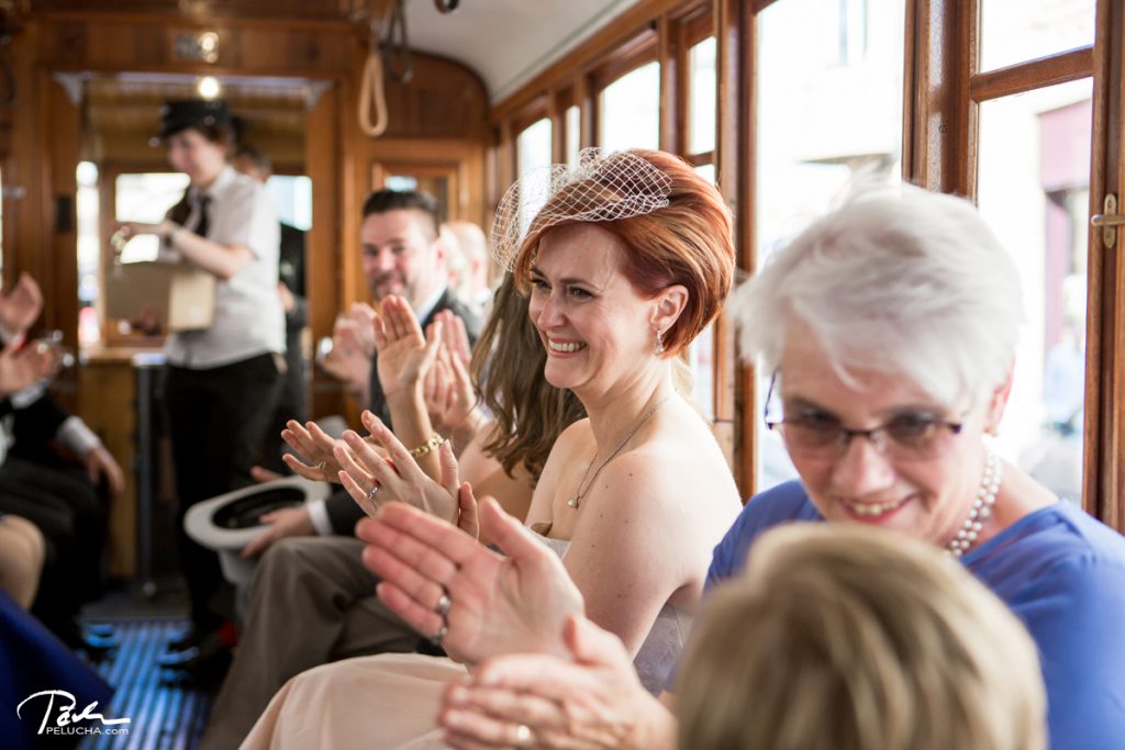 bride and guests having fun in the tram