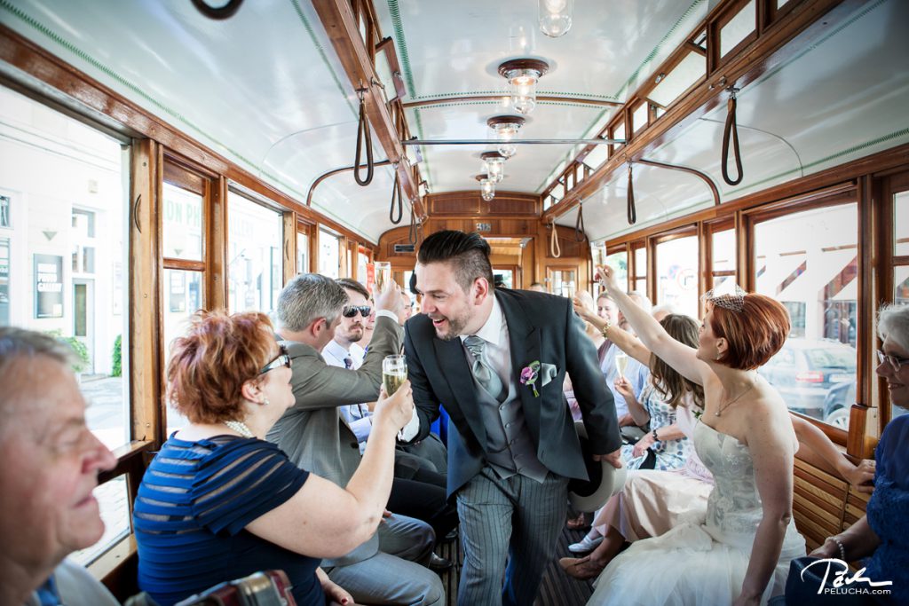 groom toasting with all the guests in the tram